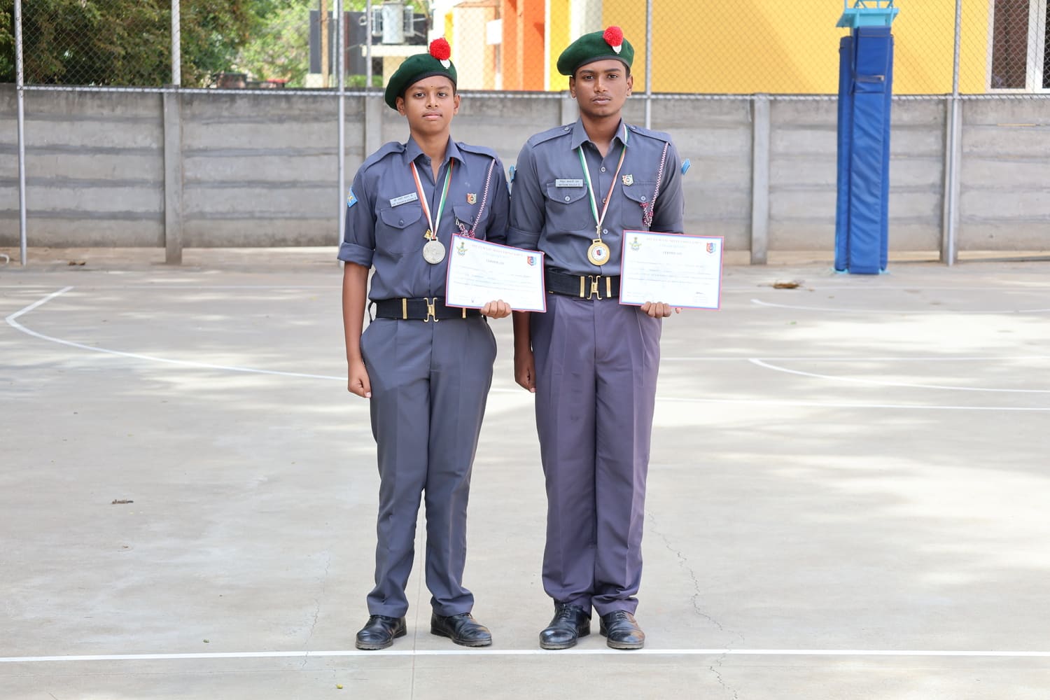Volleyball winner and runner-up with their medals and certificates